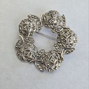 Intricate Silver Brooch with Filigree Beads in Circular Design
